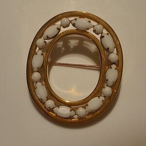 White / Goldtone Brooche